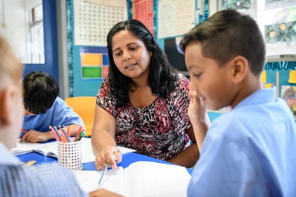 teacher and student reviewing panorama education interventions toolkit